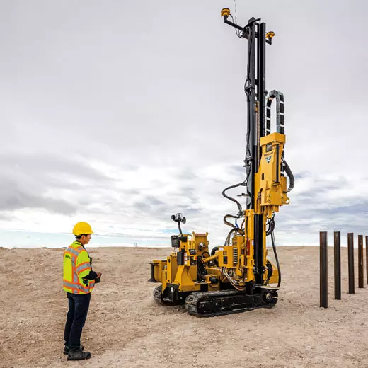 Man controlling piling machine